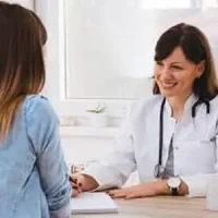2-_5_ patient and dentist discussing dental treatments at a dental clinic